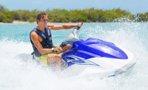 A man on a jet ski after visiting a Nassau museum.