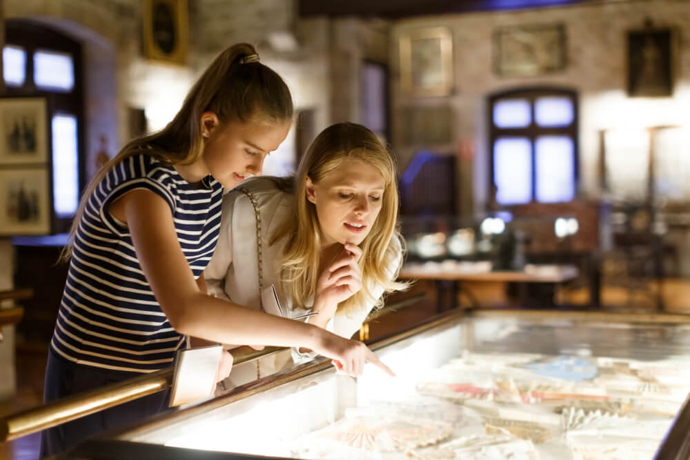 Two people looking at an exhibit in a Nassau museum.