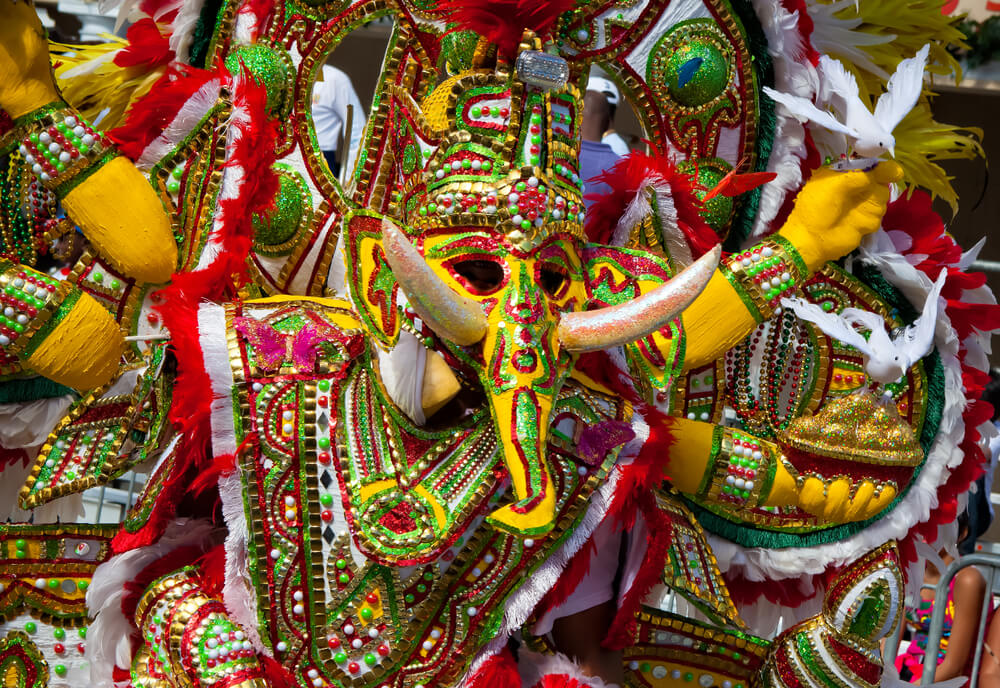 A person in costume participating in a Junkanoo parade.