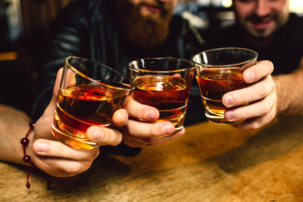 A group sampling rum at a Bahamas distillery.