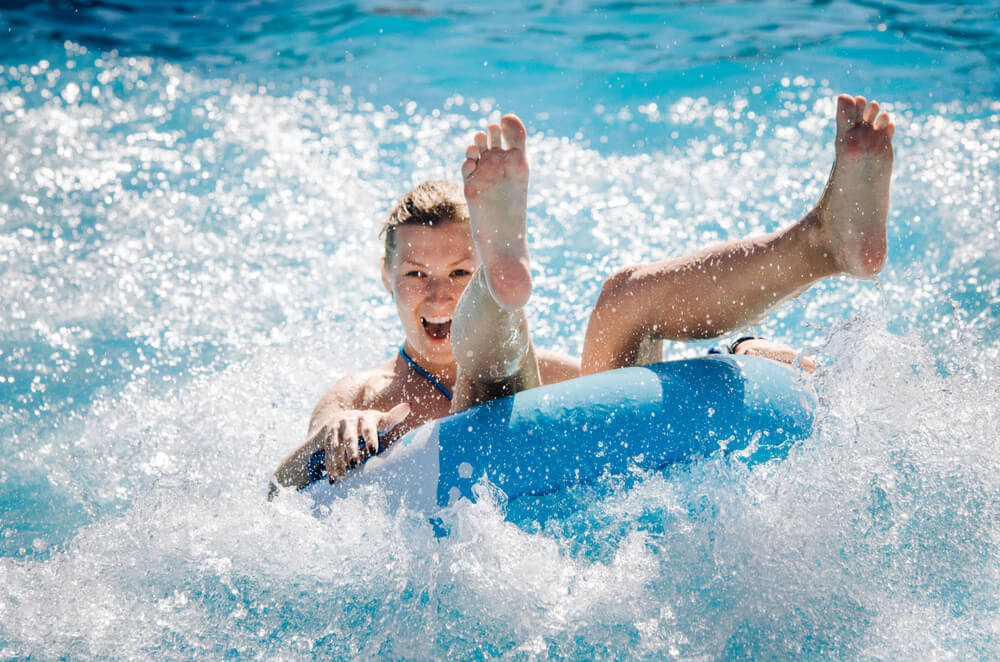 A woman coming down the slide at a waterpark in the Bahamas.